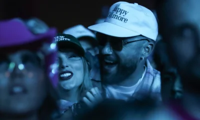 Lovebirds In the Limelight: Taylor Swift Lets Loose With Travis Kelce, Kissing And Dancing During Bleachers' Coachella set, "TRAVIS’ ARMS WRAPPED AROUND HER"