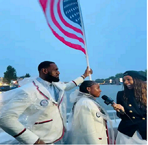 LeBron James and Coco Gauff bearing the flag for Team USA! Bron is the first male basketball player to carry the United States flag in U.S. history.