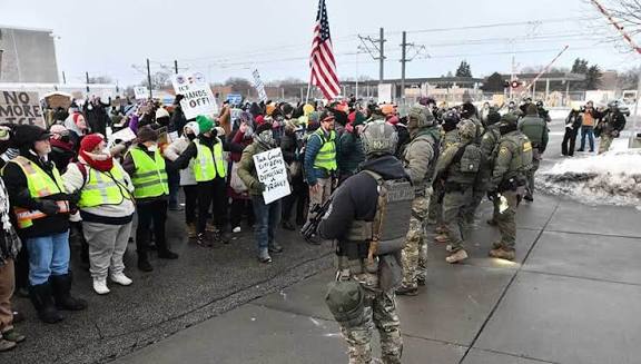 "NOW: Protesters barricading the roadway — federal agents currently unable to leave the scene following an ICE involved shooting" captures a tense, ongoing escalation in south Minneapolis on January 24, 2026.